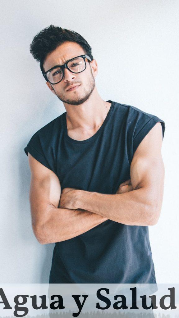 man wearing eyeglasses and sleeveless top