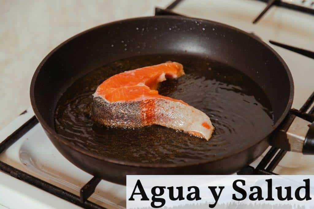 a fish is being cooked in a frying pan