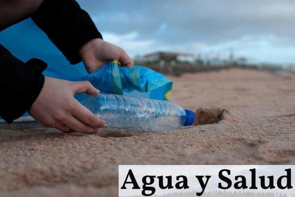 Person Holding Clear Plastic Bottle