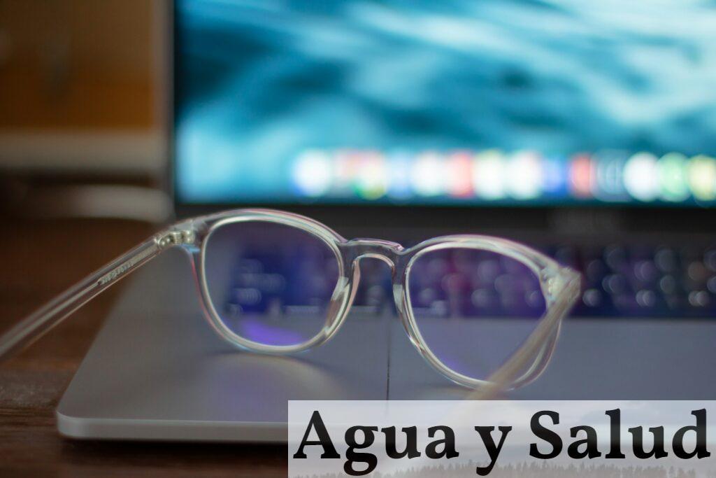 silver framed eyeglasses on white table